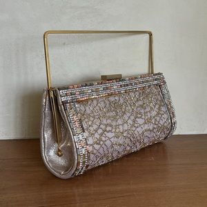 Beaded bag with gold medal top handle